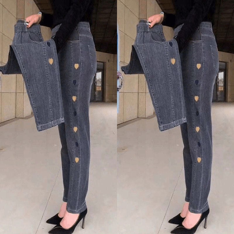 🔥 Kvinnors högelasticitet hjärtmönster broderade jeans
